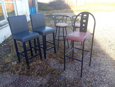 four chairs and a table outside in the yard