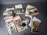 many old photos of people and buildings on the table