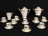 a lot of cups and saucers that are on the table