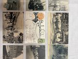 many old postcards that are sitting on a table