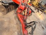 a tractor that is parked in the dirt