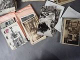many old photos of people sitting on a table