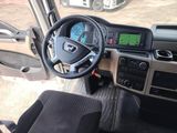 a steering wheel and dashboard of a bus