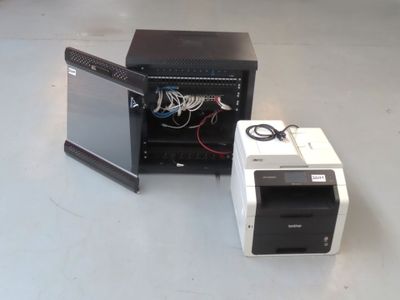 a computer and a printer sitting on a table