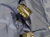 the jacket is blue and has a black tag on it