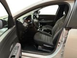 the interior of a car with the door open and the driver ' s seat up