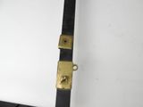 a black and gold belt with a gold buckle
