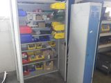 an image of a room with a refrigerator and shelves