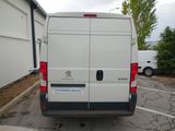 a white van that is parked in a parking lot