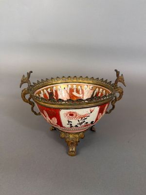 a red and white bowl sitting on a table