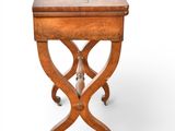 a small table with a wooden top and legs on casteors
