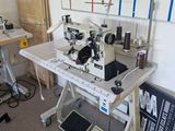a sewing machine sitting on a table in a room