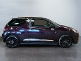 a picture of a small purple car parked in a garage