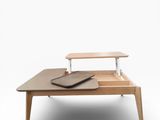 an image of a wooden table with a laptop on it