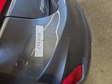 a picture of a car with a sticker on it ' s bumper