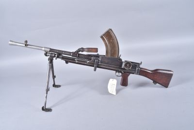 a toy gun that is sitting on a tripod