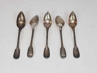 six spoons are lined up on a white surface