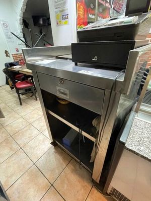 a kitchen with a stove and a refrigerator in it