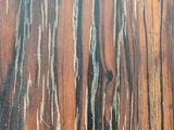 a close up view of a wood surface with peeling paint on it