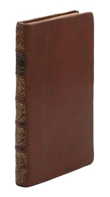 an old book with a brown leather cover on a white background