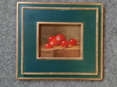 une photo représentant une photo de cerises dans un cadre