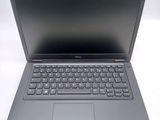 a laptop with a keyboard on it sitting on a table