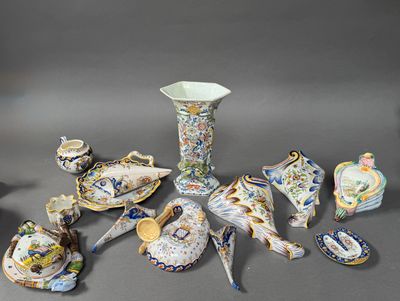 many different pieces of porcelain sitting on a table