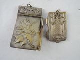 two silver lockes sitting next to each other on a table