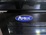 a black oven with a blue and white logo on it