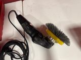 a picture of a corded brush and a wire on a counter