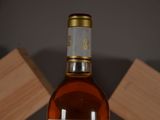 a bottle of wine that is sitting on a table