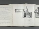 an open book with a picture of a machine on it