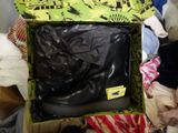 a box with a pair of black shoes inside of it