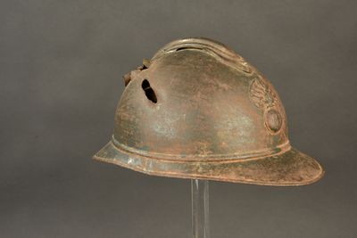 a helmet on a stand on a gray background