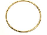 a close up of a gold ring on a white surface