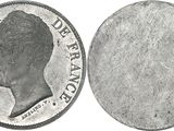 a close up of a coin with a woman ' s face on it