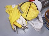 a yellow umbrella that is sitting on a table