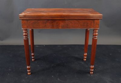a small wooden table with a drawer on top of it