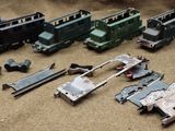 a lot of toy trains that are sitting on the ground