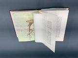 an open book with a picture of a tree on it