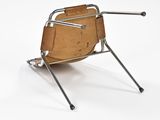 a chair that is sitting on top of a metal stand