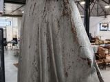 an old statue of a man with a beard in a room