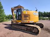 a large yellow bulldozer parked in a dirt lot