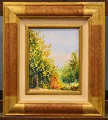 une peinture à l'huile représentant une scène forestière, dans un cadre doré