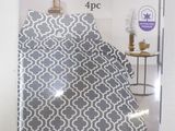 grey and white bedding with a pattern on it in a package