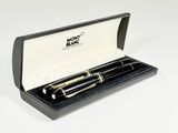 black and gold fountain pen in a black box with a white background