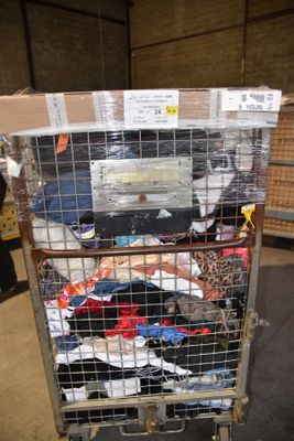 a metal cart with a bunch of clothes in it