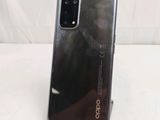 a close up of the back of an oppo phone on a white surface