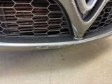 a close up of a car ' s front grill and grille
