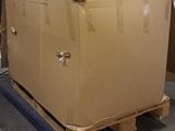 a large cardboard box sitting on a pallet in a warehouse